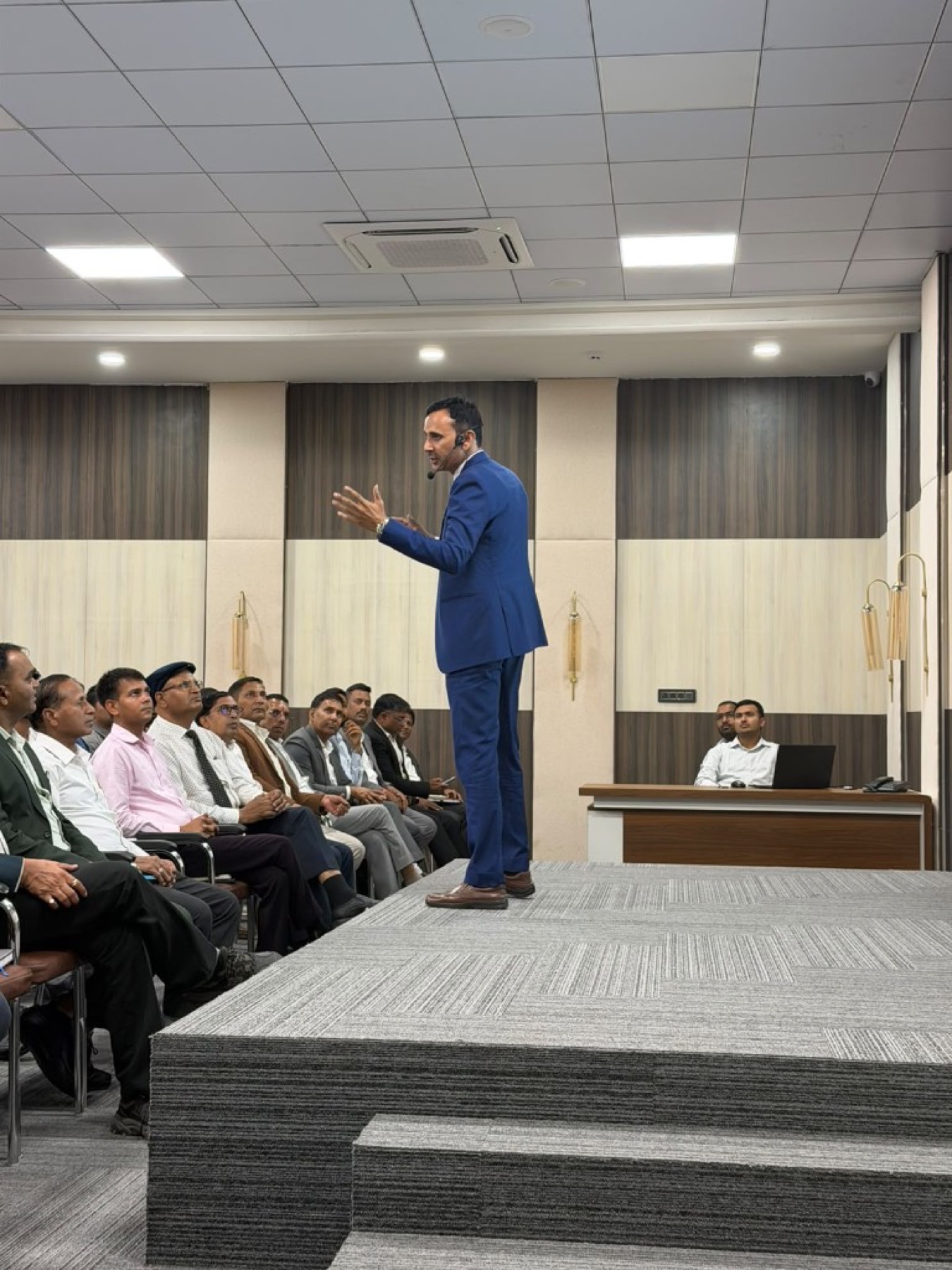 Bhupendra Singh Shekhawat speaking to a training room